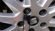 vag original wheel cap for seat leon 2013, closeup of seat leon wheel cap, vag wheel cap styling VAG Original Wheel Cap for Seat Leon 2013 Model - Key Features for Car Owners VAG Original Seat Leon Wheel Cap - 2013 Model vag, seat-leon, wheel-cap, car-accessories, auto-parts, encrypted-bolts, original-parts, car-owners, vehicle-maintenance, ai-generated